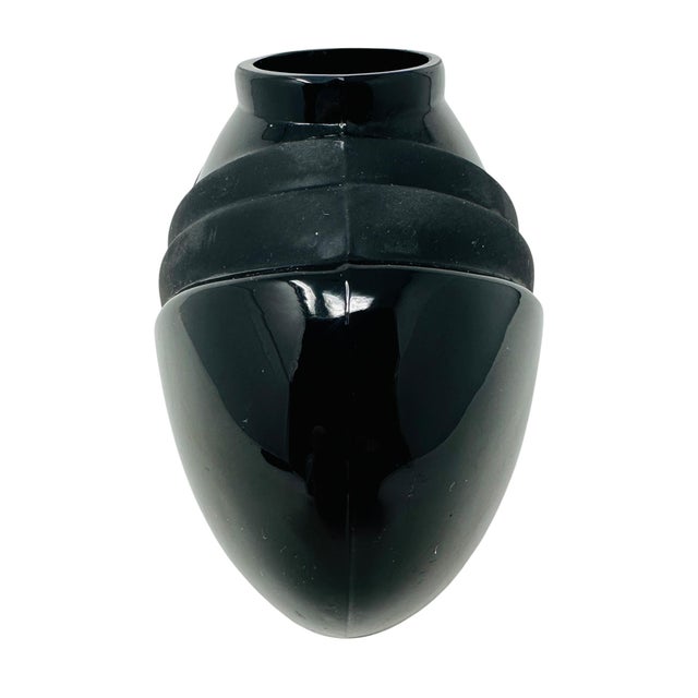 Elevate your space with this iconic piece of 1980s Art Deco Revival design. This "squat" oval vase features a sleek, high-...