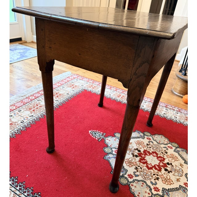 A handsome 18th-century English provincial oak side table dating to the George II or early George III period, circa...