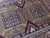 Hand-knotted wool rug from Afghanistan, woven in the Lori Pambak Kazak design — a 19th-century Caucasian pattern featuring...