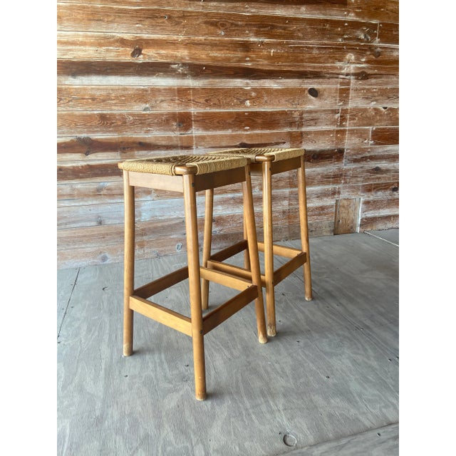 Pair of Jute Wrapped Backless Bar Stools. Sun Cabinet Co Style. Each stool is woven, twisted jute wrapped around an all...