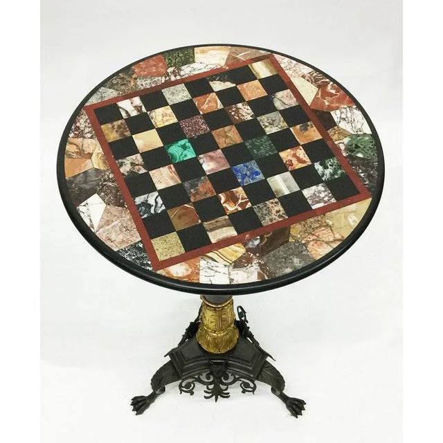 Charles X, 19th century chess table, bronze gilded inlaid with marble and stones. A bronze gilded chess table in Charels X...