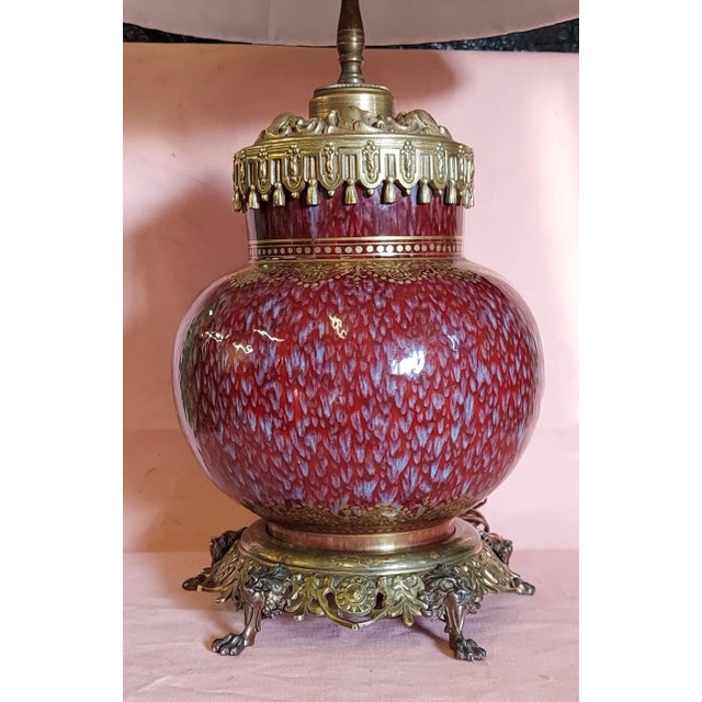 The table lamp is in fine condition. No chips or cracks plus no guilding loss. Measures roughly 30'' tall overall.