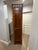 A true statement piece, this 19th-century French faux-bamboo armoire pairs sculptural detail with functional mirrored...