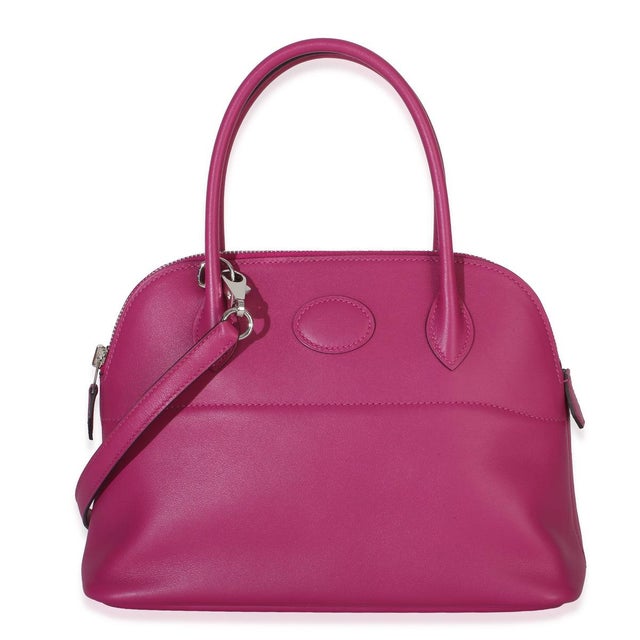 Item #: 154485 Features Interior: One slip pocket Size: 27 Handbag Closure Type: Zip-Around Dimensions: 7.8 x 7 x 4 in...