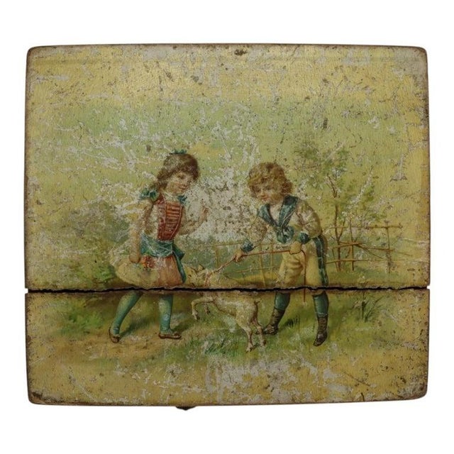 This antique mini Stella hand-crank disk player, dating to approximately 1890, features a charming hand-painted wooden...
