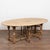 20th-century English wake table crafted in bleached oak with classic dropleaf construction. Gateleg supports allow...