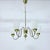 Swedish Modern, 5-light brass chandelier with with uplight shades attributed to Bergboms. The uplight shades are mounted...