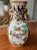 A stunning, hand-painted, decorative porcelain vase for your table or mantle decorated in an equestrian style hunting...