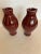 Fetching pair of glossy glazed ox blood color ceramic vases having a lovely scalloped top and bottom.