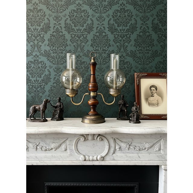 This is a vintage brass and wood double hurricane lamp, also commonly referred to as a candelabra lamp or student lamp....