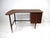 A sculptural and very functional walnut writing desk with boomerang styled top , upper smaller drawer and lower file...