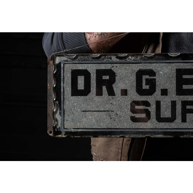 Antique medical office scalloped glass sign from Austin, MN. This piece features a carved glass exterior set into a...