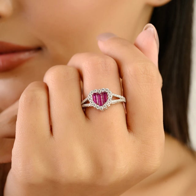 Celebrate love and sparkle with this dazzling heart-shaped ring, crafted in polished sterling silver. A vibrant pink cubic...