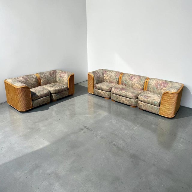 A stunning pair of vintage pencil reed modular love seats. This set comes with four corner pieces, and an extra center...