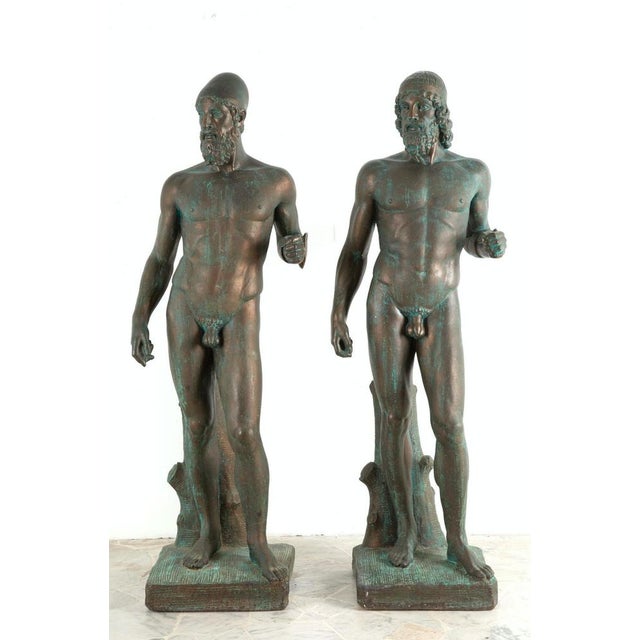 Amazing pair of "riace bronzes" early 20th century 139x50x40 cm approx. Pair of patinated plaster sculptures depicting...