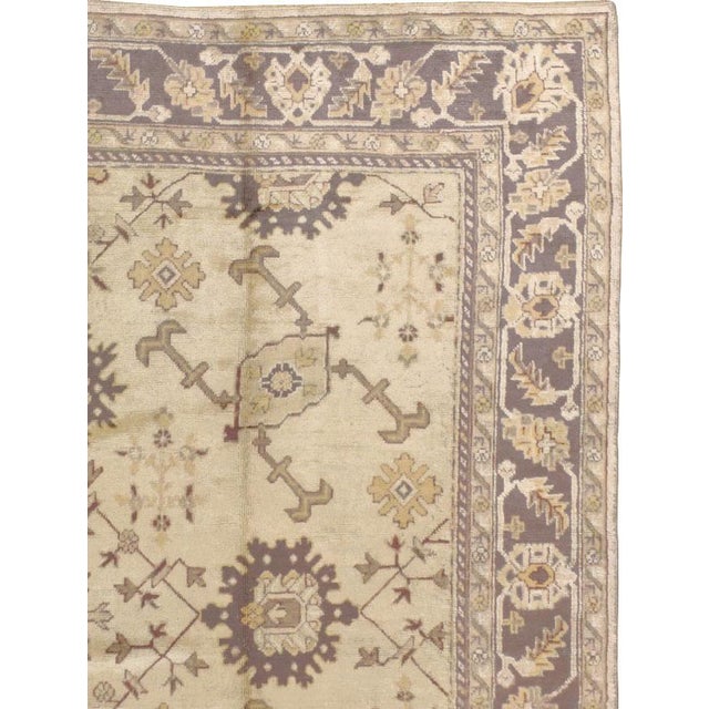 An antique Turkish Oushak carpet from the second quarter of the 20th century. Measures: 10' 1" x 15' 1"