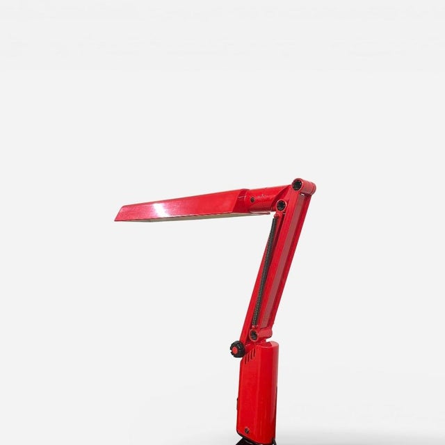 Adjustable desk lamp produced by fagerhult, sweden, late 20th century. the lamp is executed in red lacquered metal with...