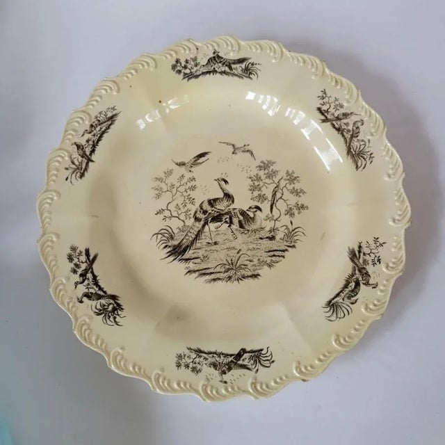 Circa 1780, English creamware 10" plate with black transfer pheasants and a molded feather edge. Made by Sadler & Green of...