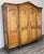 This elegant Vintage French Louis style wardrobe features beautifully carved panel doors, a gently arched cornice with...