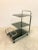 Bar trolley 70's, chromed steel structure and three shelves in smoked glass.