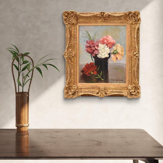 The antique French floral still life with carnations presented here is a small oil on canvas painting, mounted on...