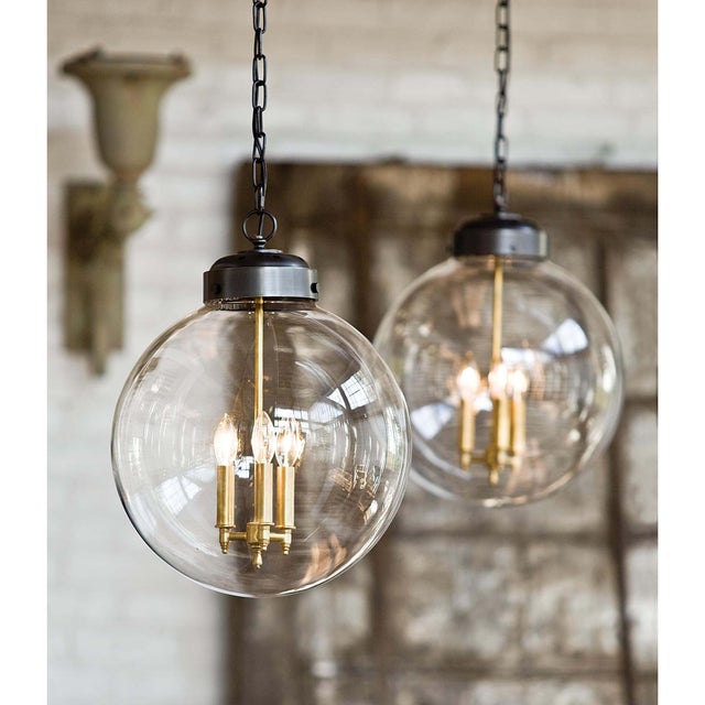 Circular glass globe pairs with three candle styled cluster to lend sculptural, contemporary style. Its clean lines and...