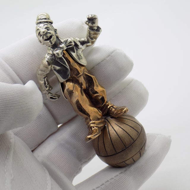 A vintage Italian figurine depicting a balancing jester, handcrafted in Arezzo, Tuscany, Italy during the 1970s/1980s by...