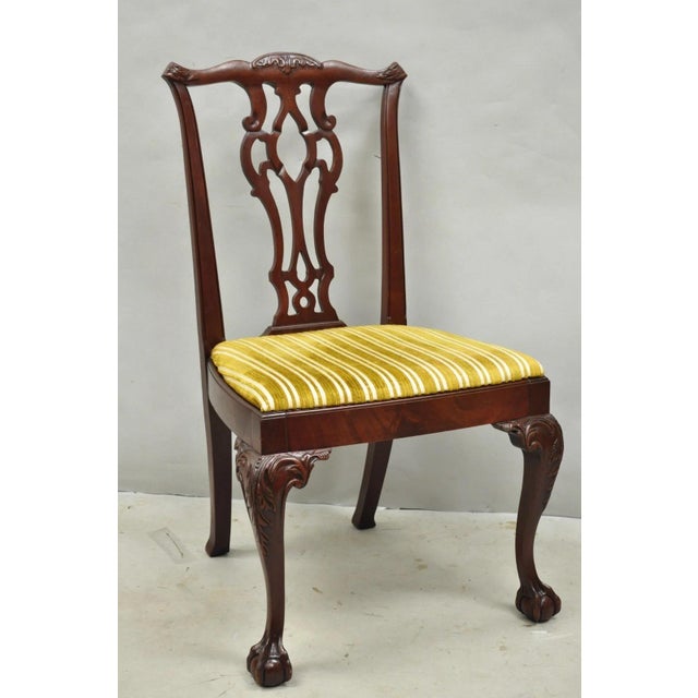Vintage John Stuart Chippendale Style Carved Mahogany Ball and Claw Dining Room Side Chairs - Set of 4. Set features...