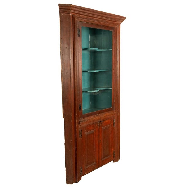 A good Antique American early 19th century Federal period painted and grain painted freestanding country corner cabinet,...