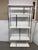 Design Plus Gallery presents a Modern Etagere. Glossy white shelves are framed by chrome-toned metal, creating a geometric...