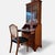 Armchair executed in the hepplewhite style with a characteristic shield-shaped backrest and carved central splat. the...