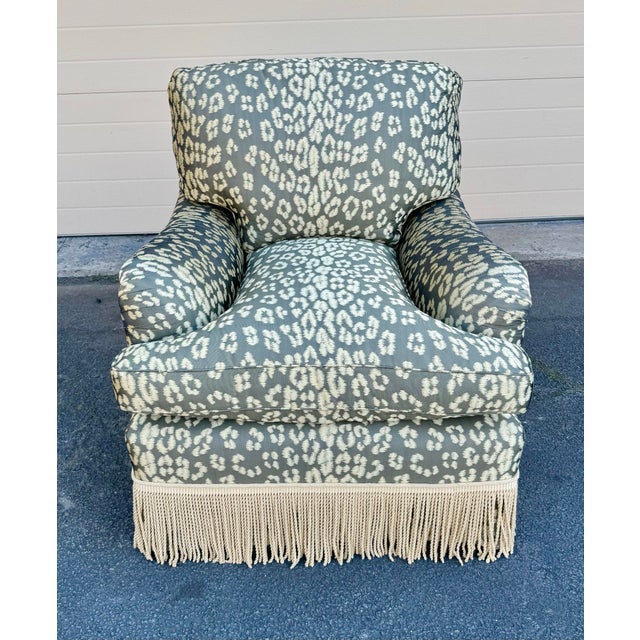 This George Smith Standard Arm Style Chair and ottoman is in a green and gold cheetah pattern silk blend fabric. The chair...