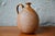 This small stoneware jug or pitcher is charmingly simple. We love its rounded, rustic, and essential shape, enhanced by a...