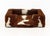 Cowhide Upholstered Dog Bed, brown and white long haired cowhide. 13.5" H x 40" W x 32" D. Provenance: From a Forest Hills...