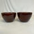 This is a lovely pair of brown glazed ceramic planters. They have sand-colored inside bowls and a Majolica finish. These...