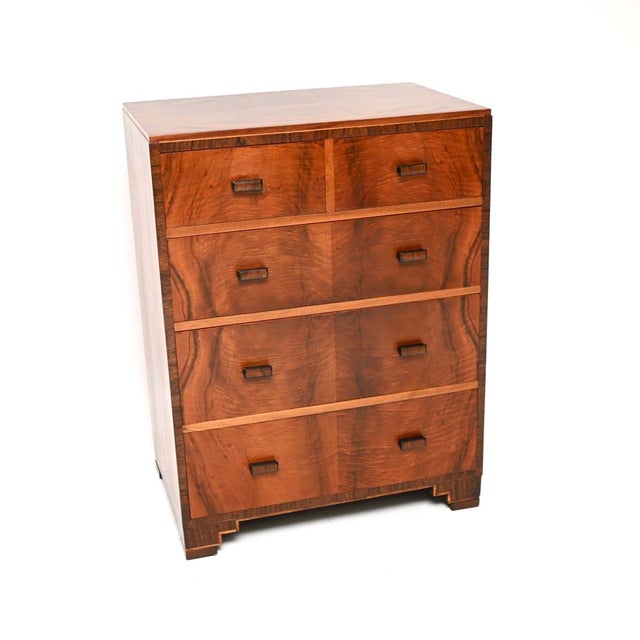 A stylish and extremely well made Art Deco figured walnut chest of drawers by Heal’s. This was made by and retailed in...
