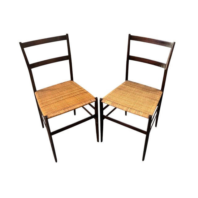 Pair of model 699 “superleggera” chairs, designed by gio ponti (1891-1979) for cassina (unsigned) in 1957. the model is...