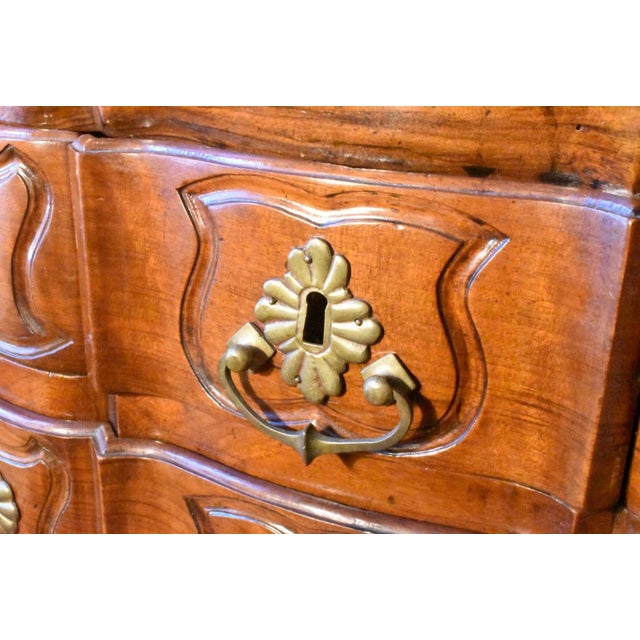 This robust fruitwood secretary is of the Louis XV period, early 18th century. The sloping lid has a shaped interior with...