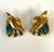 A pair of bespoken earrings by French Art Jeweler Line Vautrin (1913-1997). The cast bronze earring features a sculptural...