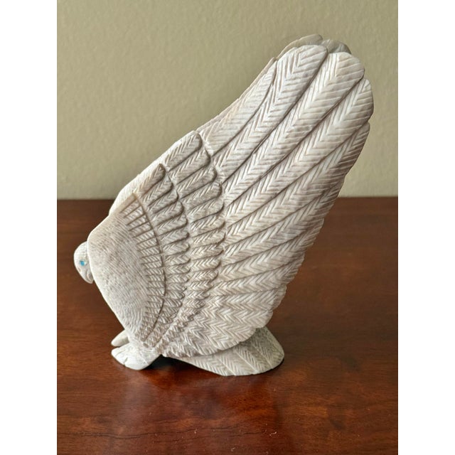 Intricate American Indian Zuni eagle of carved antler. Bottom is signed by maker. Most items found at Pub & Oasis are...