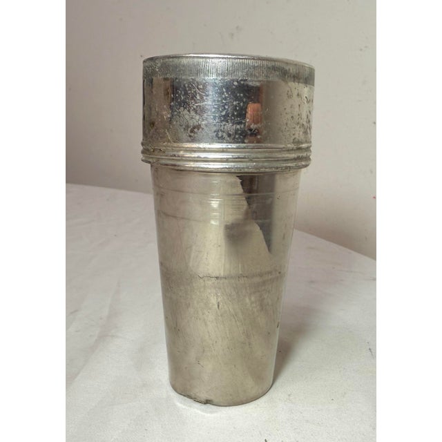 The product consists of 5 vintage Landers Frary & Clark universal silver plated travel nesting cups. Made in the United...
