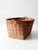 A vintage woven rattan basket with a wonderfully structured rectangular form and small loop handles at each end. The fine...