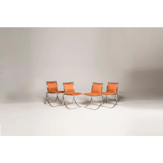 Set of 4 chairs with chromed steel structure and recently orange reupholstered seats. size of each chair: d 54 cm w 45 cm...