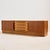 Newly restored teak sideboard with unique handles from the 1960s. This teak beauty has plenty of storage space with two...