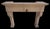 A striking French Louis XIV style fireplace mantel crafted in limestone during the 20th century. This piece showcases a...