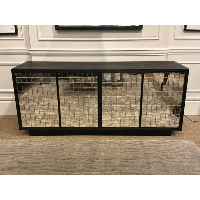 Stylish Currey & Co Mosaico Credenza. Black wood with mirrored mosaic style front. Original retail $5490. Showroom floor...