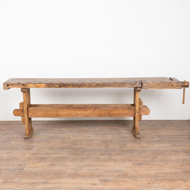 It is the years of constant use revealed in every ding and scratch that enrich the character of this carpenters' workbench...
