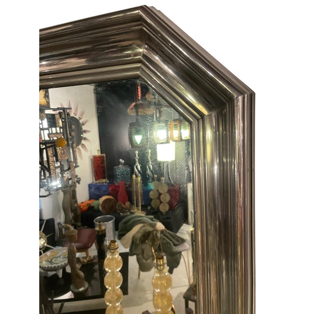 Stainless Steel Mirror attributed to Maison Jansen, 1970, in Good conditions. Designed 1970 to 1979 This piece is...