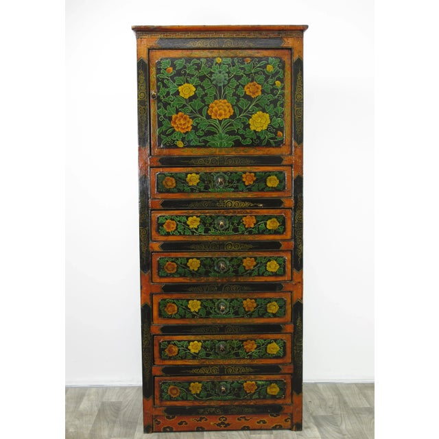 This vintage Tibetan chest is colorfully decorated with exuberant flowers to represent the exotic Tibetan culture and its...