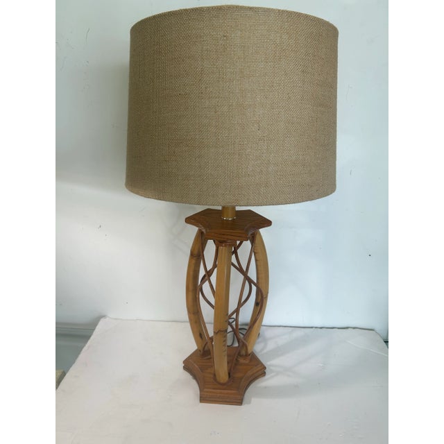 Beautiful rattan lamp will add a nice tropical feel to any interior. Has great twist detail between a thick faux bamboo...